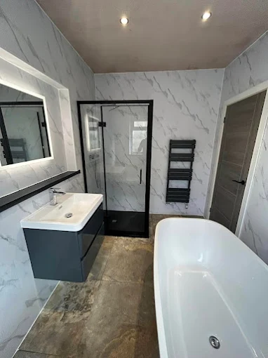 CIWB Construction fitted bathroom with shower and sink